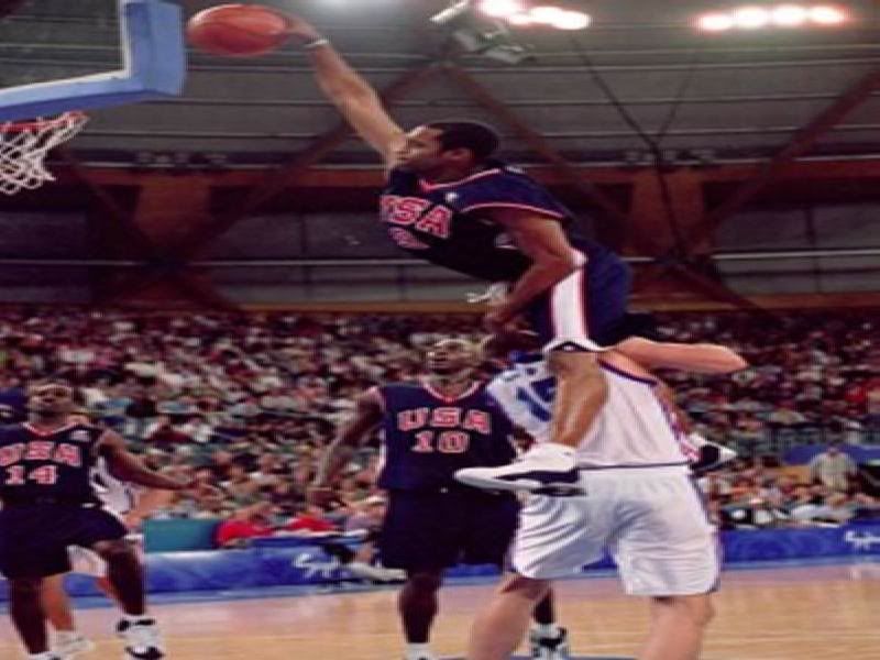 vince carter dunks on 7 footer. and dunked on that 7 foot