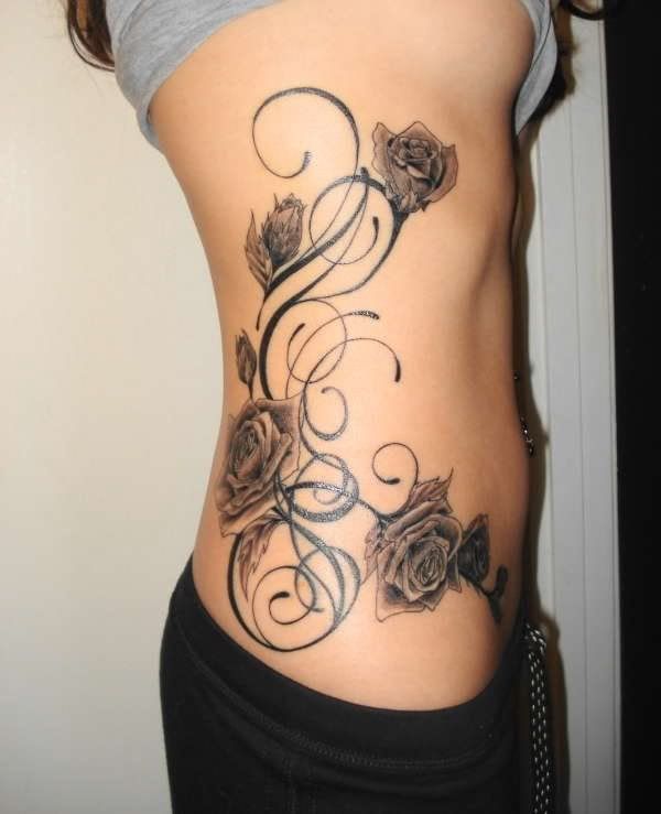 tattoos for girls on hip and side. tattoo pictures for women on side. side flower tattoos for women