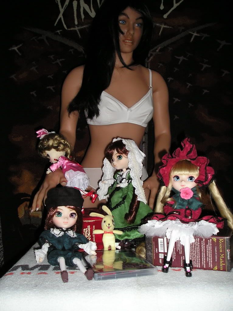 Lily and a few of the Rozens Lily trying to handle some mischievous dolls